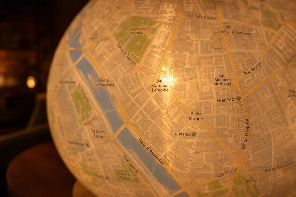 Close-up of transparent city map wrap on a glowing glass sphere